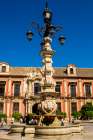 Palacio Arzobispal and Fuente Farola, Plaza Virgen de los Reyes, Seville, Andalusia, Spain. Art Print